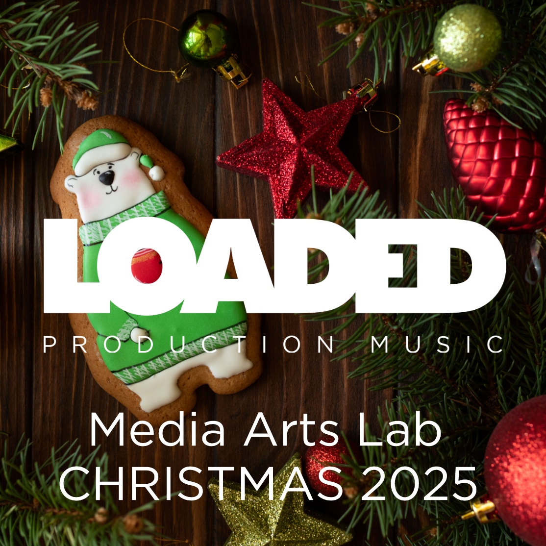 Christmas table with festive polar bear cookie and Loaded Production Music logo